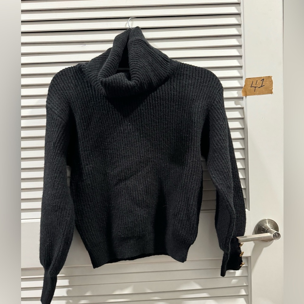 Woman’s vowel neck sweater size small